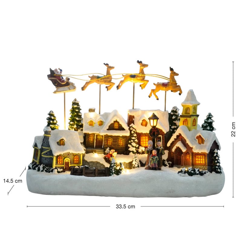 Village de Noël avec traîneau volant - animé à piles et lumineux Village de Noël avec traîneau volant - animé à piles et lumineux